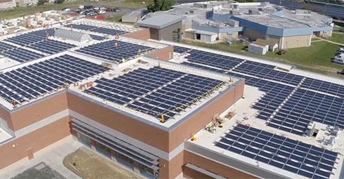 aerial photo of new net zero building solar panel roof